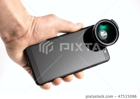 Human hand with smartphone and lens. 47515096