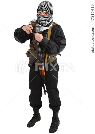 insurgent dressed in black uniform and black and white shemagh with AK 47 rifle insurgent dressed in black uniform and black and white shemagh with AK 47 rifle 47515419