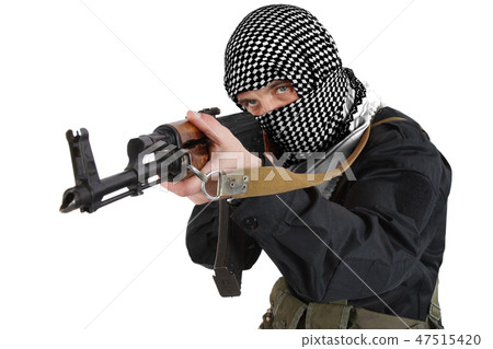 insurgent dressed in black uniform and black and white shemagh with AK 47 rifle insurgent dressed in black uniform and black and white shemagh with AK 47 rifle 47515420