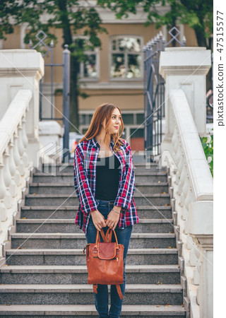 Woman standing on the staircase Woman standing on the staircase 47515577