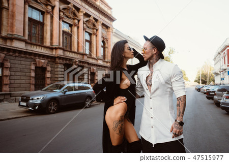 A young, sexy couple of lovers pose for a camera on the streets 47515977