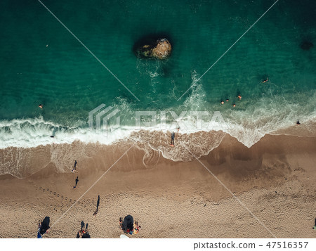 Aerial View From Flying Drone Of People Relaxing Aerial View From Flying Drone Of People Relaxing 47516357