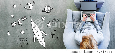 Dream of space and rocket with man using a laptop 47516744