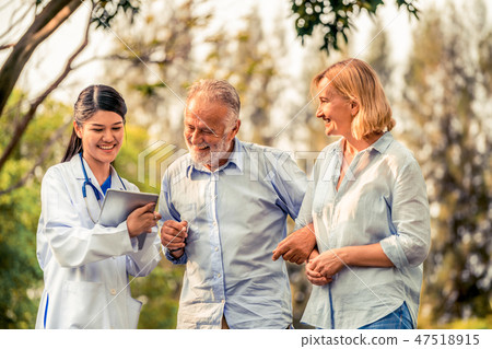 Senior couple talking to nurse or caregiver. Senior couple talking to nurse or caregiver. 47518915