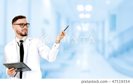 Doctor pointing at empty copy space for your text. 47519354