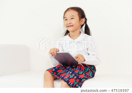 Little kid on white background with tablet. Little kid on white background with tablet. 47519397