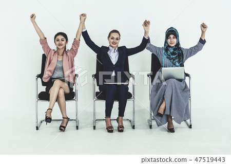 Happy young businesswomen celebrating success. Happy young businesswomen celebrating success. 47519443