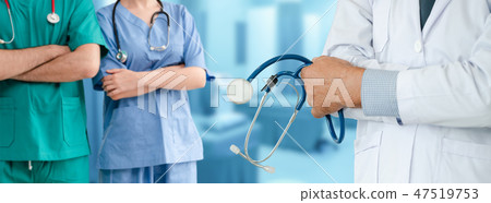 Doctor working in hospital with other doctors. Doctor working in hospital with other doctors. 47519753