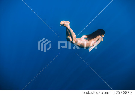 Naked woman swim in sea, underwater in ocean Naked woman swim in sea, underwater in ocean 47520870