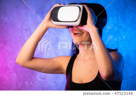 Woman looking with VR device and feeling excite 47523148