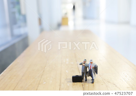 a busines of figure people on stage 47523707