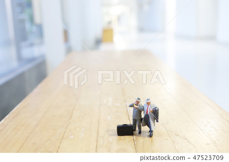 a busines of figure people on stage 47523709