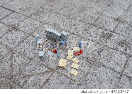 a mini worker figure using a trolley a mini worker figure using a trolley 47523767