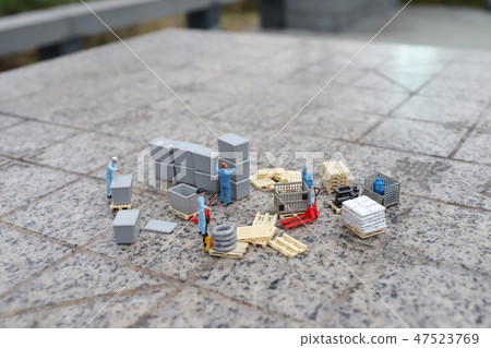 a mini worker figure using a trolley 47523769