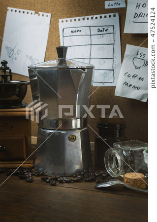The vintage roaster coffee on wood table. The vintage roaster coffee on wood table. 47524124