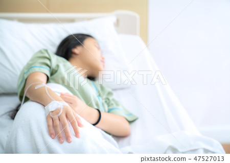 Asian lady patient sleep saline solution line  47527013