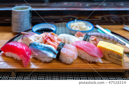 Sushi set on wooded plate in Japanese seafood  47528314