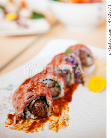 Japanese Wagyu beef sushi maki rolls with sauce Japanese Wagyu beef sushi maki rolls with sauce 47528571