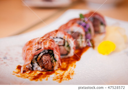 Japanese Wagyu beef sushi maki rolls with sauce Japanese Wagyu beef sushi maki rolls with sauce 47528572