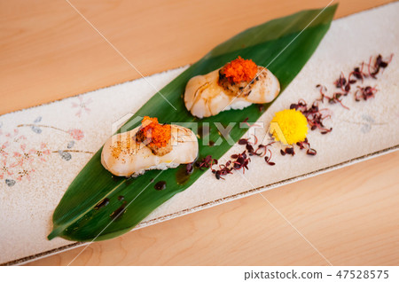 Japanese Engawa sushi on ceramic plate Japanese Engawa sushi on ceramic plate 47528575