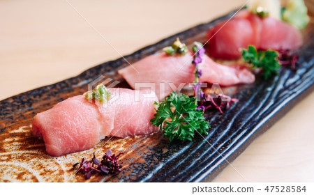 Japanese Otoro tuna sushi on ceramic plate Japanese Otoro tuna sushi on ceramic plate 47528584