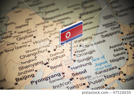North Korea marked with a flag on the map 47528830