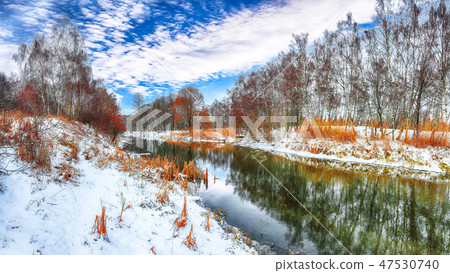 Scenic view of the river and trees in winter 47530740