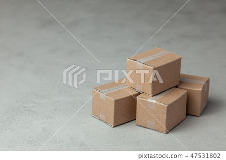 Moving day. Trucking by traveling to new apartment or office. Paper boxes and on gray background 47531802