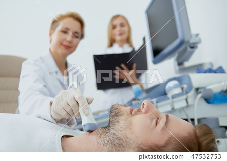 Man, doctor and nurse on medical examination. 47532753