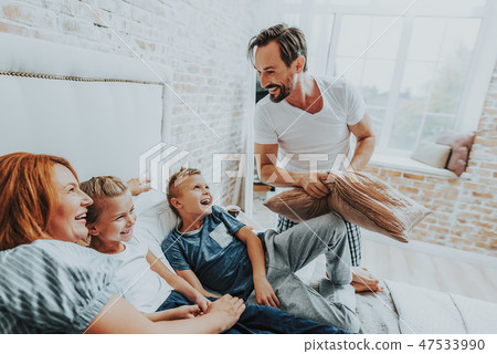 Smiling family having fun together in morning 47533990