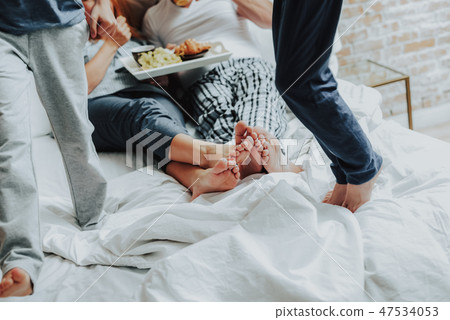 Happy children jumping on bed in morning Happy children jumping on bed in morning 47534053