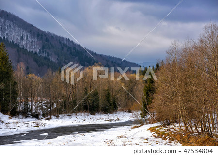 Beautiful winter landscape with a mountain river Beautiful winter landscape with a mountain river 47534804