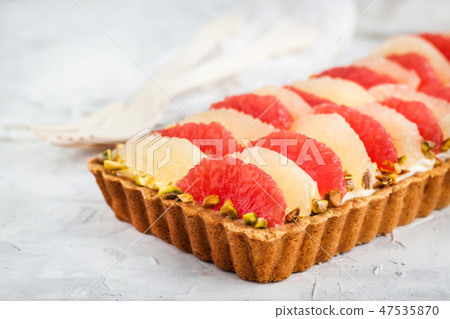 Delicious citrus mascarpone and pistachio tart Delicious citrus mascarpone and pistachio tart 47535870