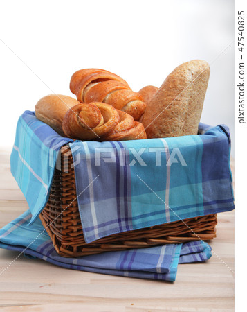 Bread and pastry in the basket Bread and pastry in the basket 47540825