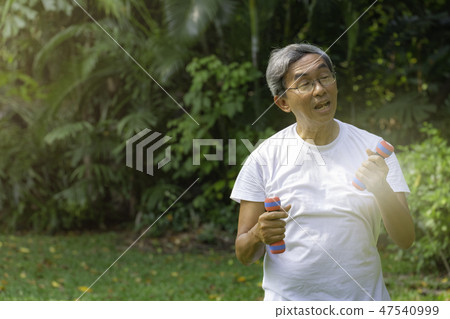 Senior asian lift weight in the morning. 47540999