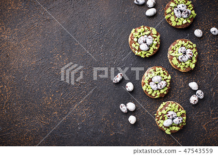Easter cookies in shape of nest with eggs Easter cookies in shape of nest with eggs 47543559