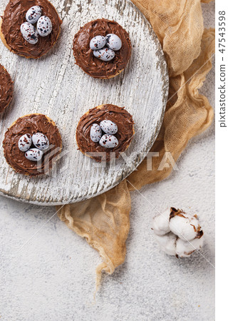 Easter cookies in shape of nest with eggs Easter cookies in shape of nest with eggs 47543598