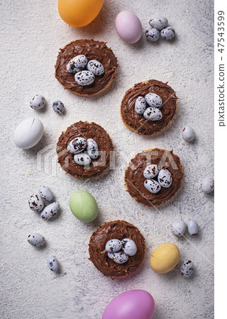 Easter cookies in shape of nest with eggs Easter cookies in shape of nest with eggs 47543599