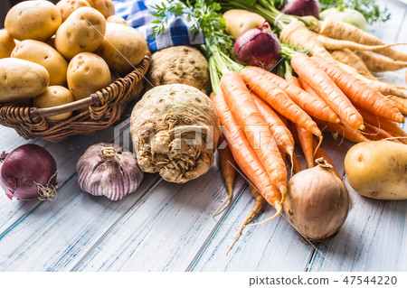 Assortment of fresh vegetables on wooden table. Assortment of fresh vegetables on wooden table. 47544220