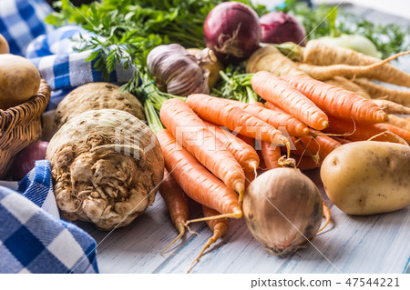 Assortment of fresh vegetables on wooden table. Assortment of fresh vegetables on wooden table. 47544221