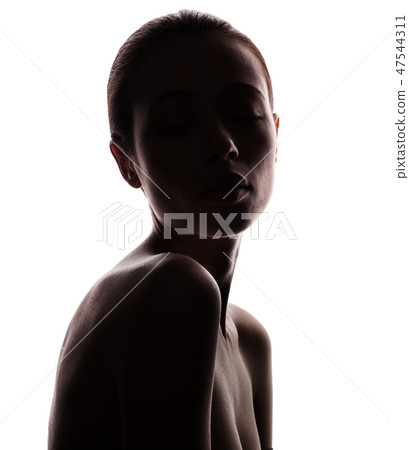 silhouette of beautiful young woman 47544311