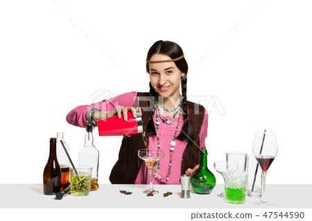 Expert female barman is making cocktail at studio 47544590
