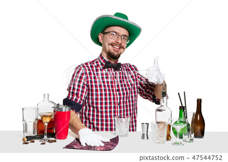 Expert barman is making cocktail at studio 47544752
