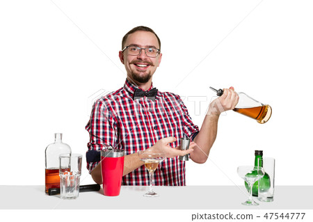 Expert barman is making cocktail at studio Expert barman is making cocktail at studio 47544777