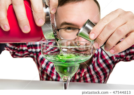 Expert barman is making cocktail at studio 47544813