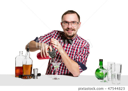 Expert barman is making cocktail at studio 47544823