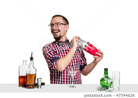 Expert barman is making cocktail at studio 47544826