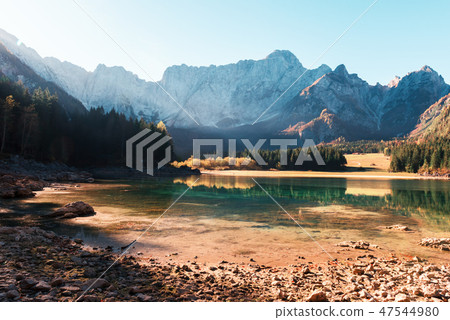 Colorful sunrise on Fusine lake Colorful sunrise on Fusine lake 47544980