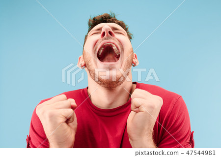 Winning success man happy ecstatic celebrating being a winner. Dynamic energetic image of male model Winning success man happy ecstatic celebrating being a winner. Dynamic energetic image of male model 47544981