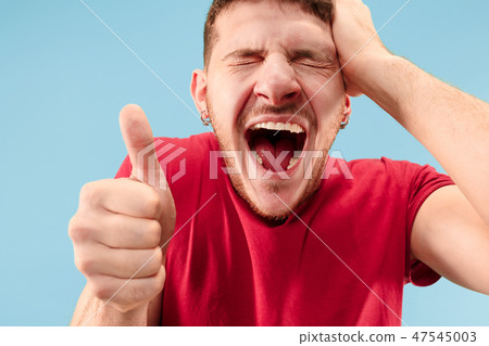 Winning success man happy ecstatic celebrating being a winner. Dynamic energetic image of male model Winning success man happy ecstatic celebrating being a winner. Dynamic energetic image of male model 47545003